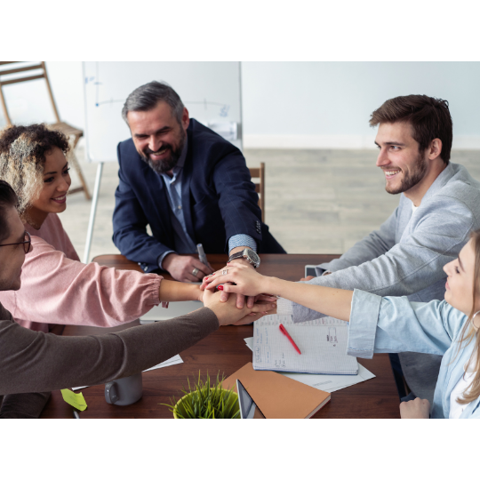 A group of people happily working together.